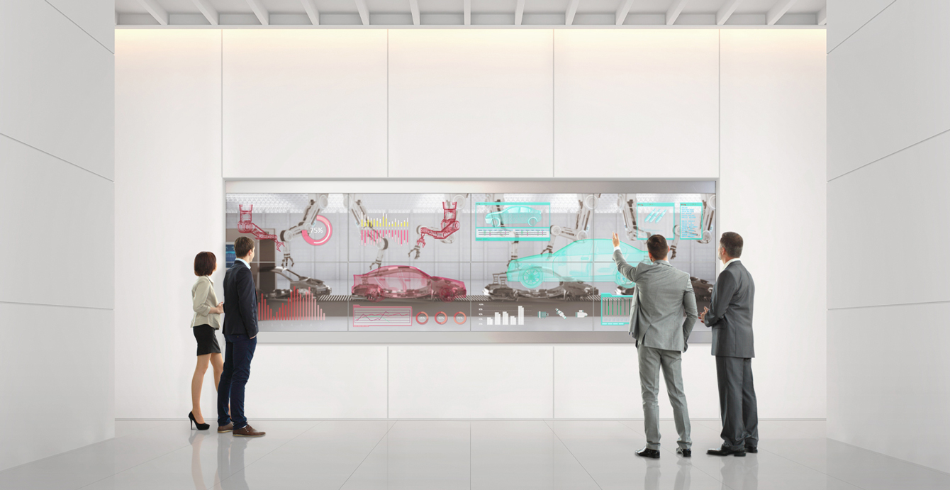People analyze their work using the transparent OLED screens installed on the wall of the lobby.
