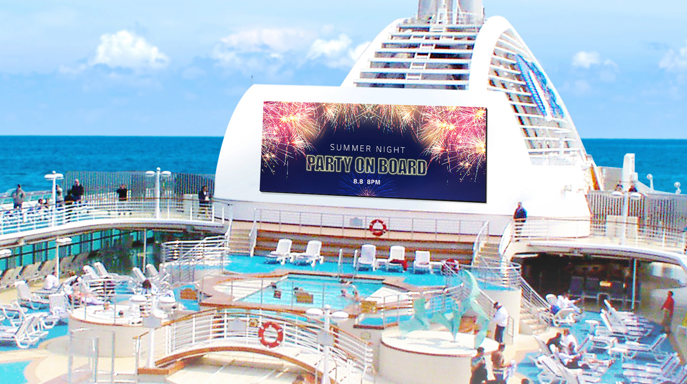 People are enjoying swimming in the cruise’s pool, and a large LED is hanging on the walls on board. The LED screen is promoting the cruise’s Summer Night Party that will be held on the cruise.
