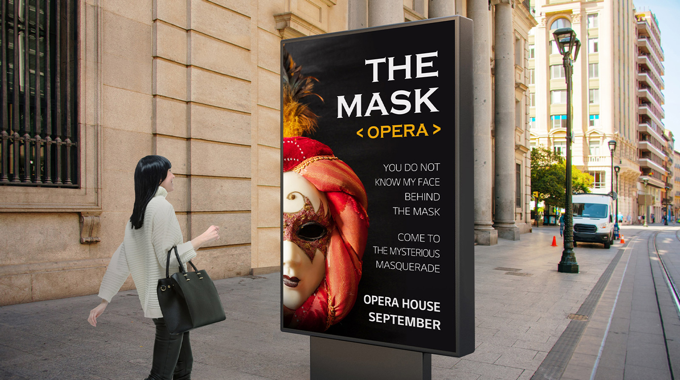 A display as tall as a person is installed at eye level on the street, and a woman who is walking past is watching a clear-image-quality opera advertisement on the display’s screen.