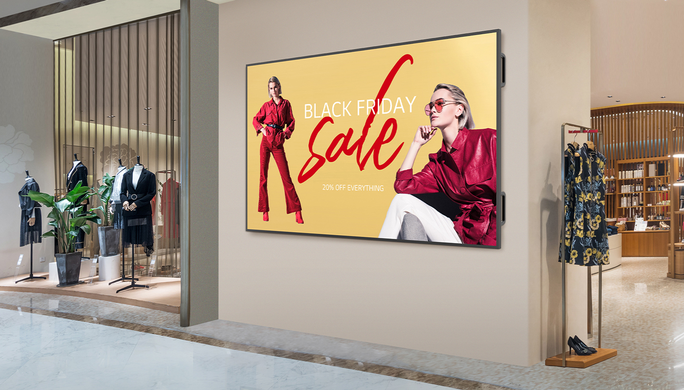 A large display is installed on a shopping mall’s interior wall, and the display’s screen is showing advertisements clearly and vibrantly.