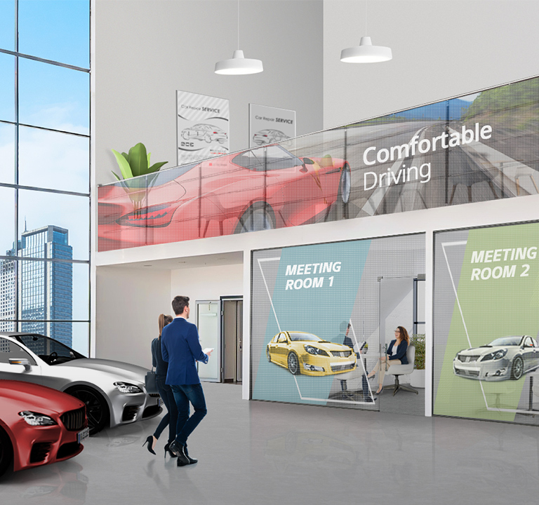 Transparent LED films are attached to the offices’ glass walls and the handrail glass inside the car dealership, and they are showing car advertisements well.