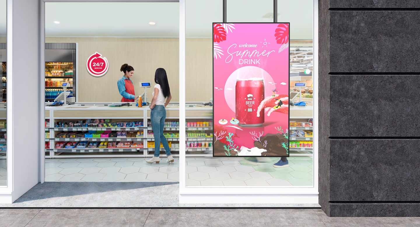 A large LED display is installed on the window inside the convenience store, vividly and brightly showcasing advertisements through the glass.