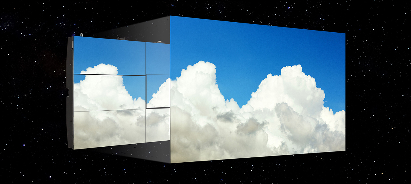 The LG MAGNIT screen, with minimal gaps between modules, shows the blue sky and puffy clouds without color deviation..