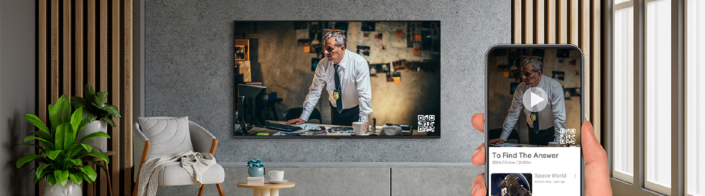 A hotel guest is using OTT services by pairing their smartphone with the in-room TV through QR code login.