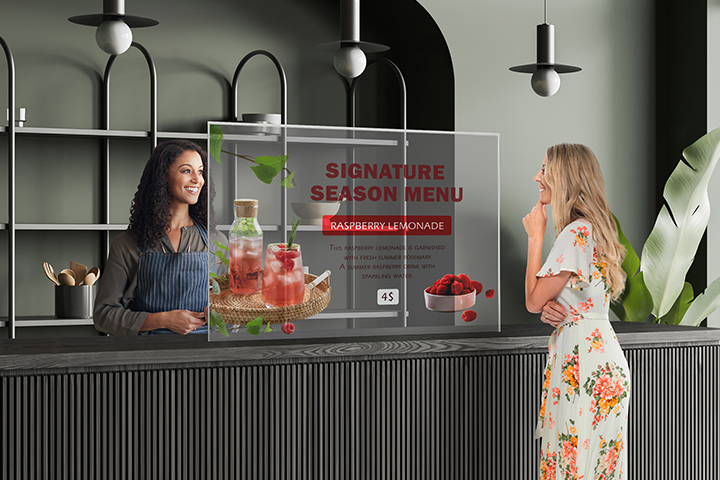 A cafe has Transparent OLED Signage installed, and a woman is checking the menu by looking at the Transparent OLED Signage screen